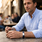 Arequipa Greek key leather bracelet, navy with silver clasp, worn with a light blue shirt