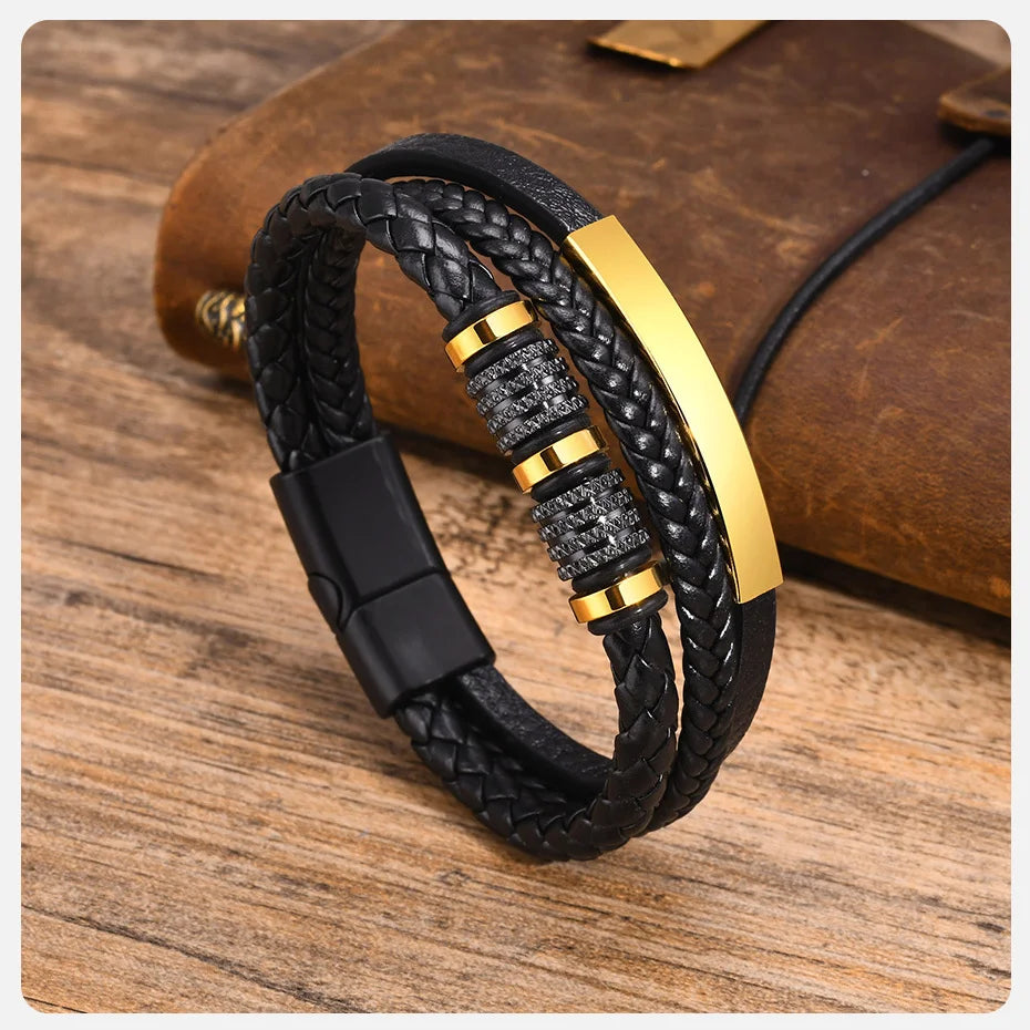 Gold & Black braided leather bracelet on a leather notebook