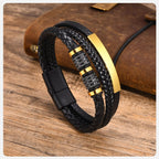 Gold & Black braided leather bracelet on a leather notebook