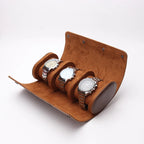 Brown 3-watch roll open with three watches, white background