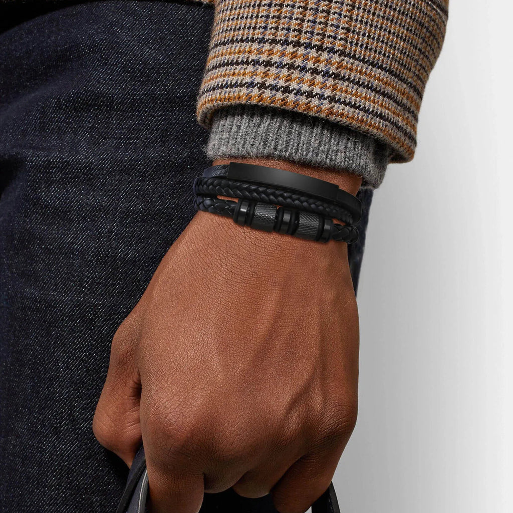 Man wearing the All Black braided leather bracelet with a tweed jacket