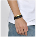 Gold & Black engraved bracelet worn on the wrist